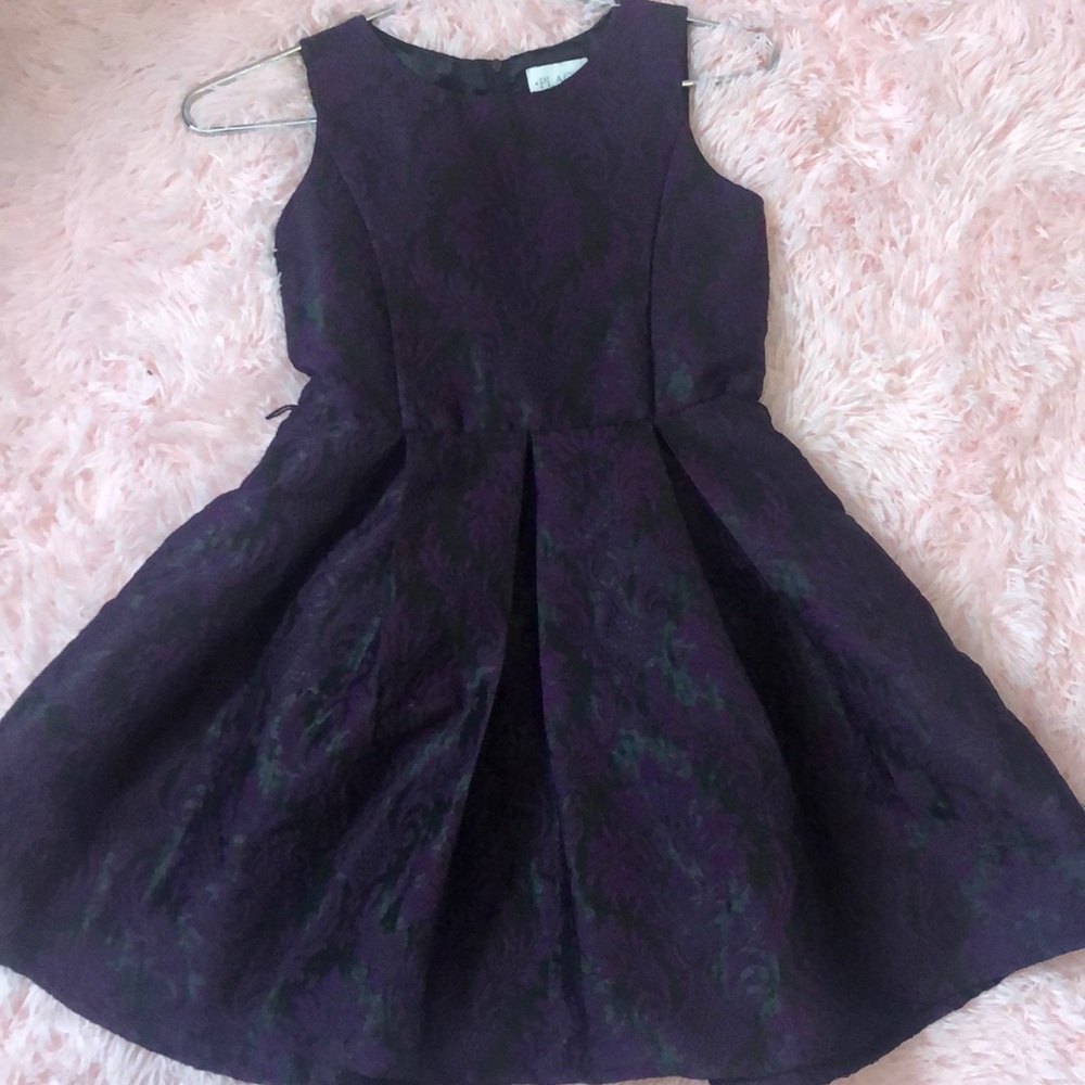 A black dress with purple design
